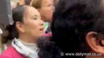 Hospital trust vows to investigate nurse photographed in her scrubs at pro Palestine demonstration where she appeared to join in chants