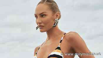 Candice Swanepoel turns up the heat in a sexy striped bikini on the beach