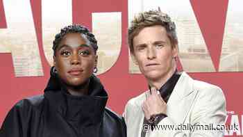 Lashana Lynch hides her growing baby bump beneath an oversized black gown as she joins elegant co-star Eddie Redmayne at The Day Of The Jackal screening in Berlin