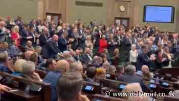 Astonishing moment Polish politicians chant 'Donald Trump, Donald Trump' in parliament as they celebrate his victory over Kamala Harris