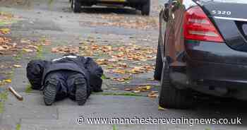 Police search streets, gutters and underneath cars after two men stabbed in Manchester