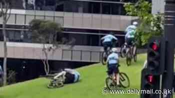 NSW Police officer falls off his bike while trying to cycle up a steep hill