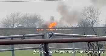 Horrifying moment car bursts into flames on M61 after crashing as motorway shuts