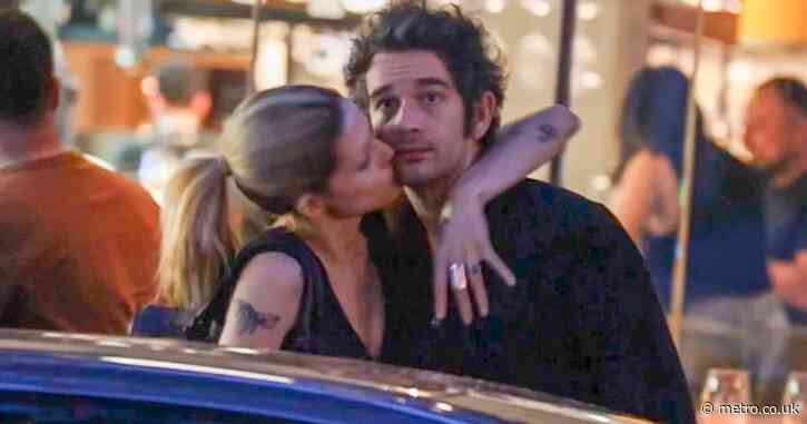 Matty Healy and fiancée ramp up the PDA with steamy snog on streets of Sydney