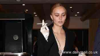 Lily Rose Depp puffs on a cigarette while supporting girlfriend 070 Shake at Petrichor premiere in Los Angeles