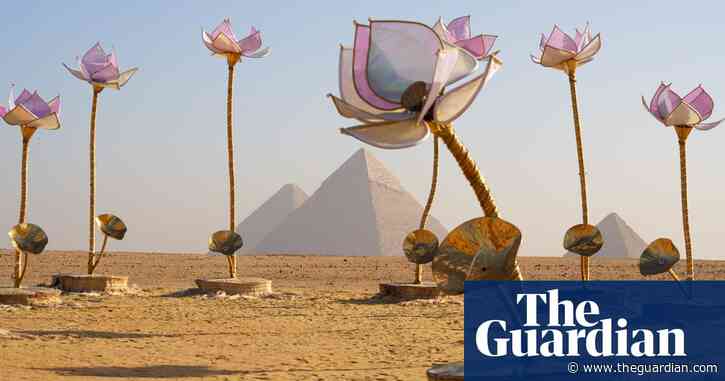 Giant flowers, a buried chariot and temples in the sand: the art show in the shadow of Giza pyramids