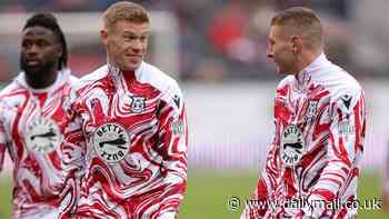 Irish Wrexham star James McClean refuses to link arms with team-mates and stands alone for Remembrance silence, before fans sing he 'hates the King' after latest refusal to wear poppy