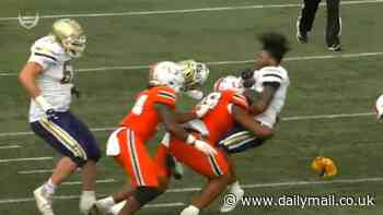 Sickening moment college player has helmet knocked off and left floored by terrifying hit in Miami vs Georgia Tech