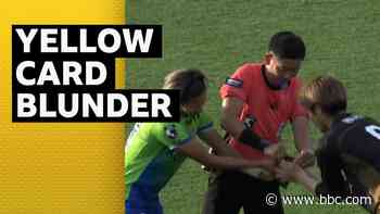 Referee needs help from players when yellow card gets stuck