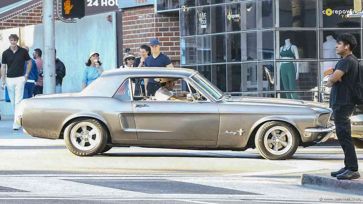 Brooklyn Beckham goes for a spin in his classic Mustang in Los Angeles after adding another car to his impressive collection