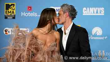 Rita Ora shares a red carpet kiss with husband Taika Waititi ahead of her history-making THIRD hosting gig at the star-studded MTV EMAs