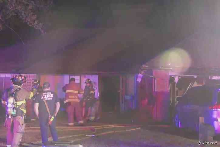 Firefighters battle house fire in Moore