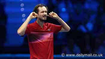 Daniil Medvedev sticks his fingers in his ears and claims he is 'blocking out the noise' as he seals victory against Alex De Minaur following huge ATP Finals on-court meltdown