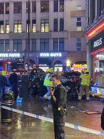 Three rushed to hospital after car smashes into Piccadilly Circus Angus Steakhouse as diners are inside