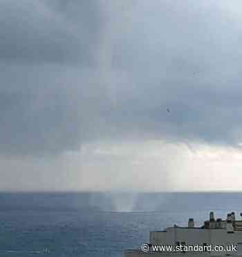 Dramatic moment tornado approaches Marbella beach as thousands evacuate 'extreme' rainfall in Spain