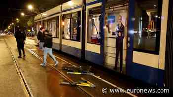 Dutch police disperse people from streets after Amsterdam tram set on fire