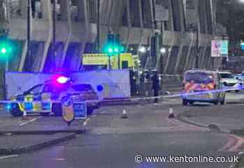 Police cordon off main road outside town car park