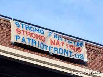 Durham restaurant employees tear down white nationalist group's banner from American Tobacco Campus