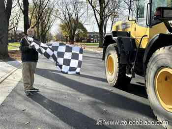 Toledo mayor waves checkered flag on end of the 2024 roads program