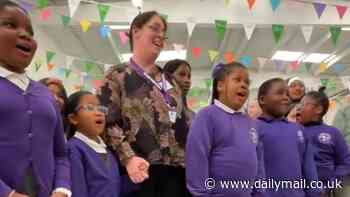 Sweet moment King Charles is treated to rendition of 'Happy Birthday' by schoolchildren at Coronation Food Hub visit - before traditional gun salutes ring out across Britain