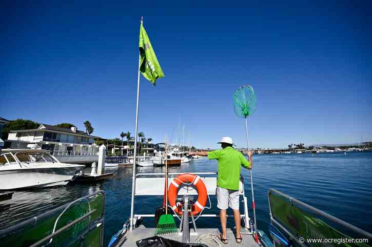 Pontoon boat scoops up trash in Newport Harbor — with a splash of creative marketing for realtor