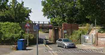 Van crashes into railway bridge and blocks road - updates