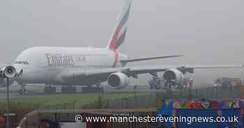 Fire crews surround Emirates plane on runway at Manchester Airport after 'loud bang'