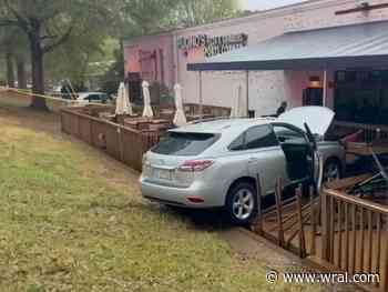 Cars crash into sports bar patio on rainy night in Raleigh