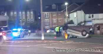 A car has landed on its roof after a crash on a busy Colchester roundabout