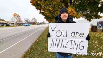 Amherstburg's 'sign guy' brings joy to the streets and to social media