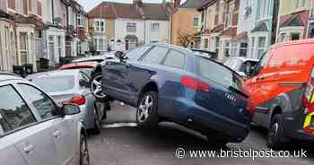 Bizarre moment Audi mounts parked car on Bristol street