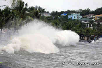 Latest typhoon lashes the Philippines, causing tidal surges and displacing thousands