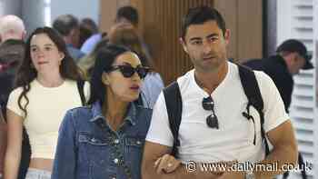 Terry Biviano shows off her trim pins during a spot of luxury shopping with husband Anthony Minichiello in Sydney after attending Anthony Bell's wedding in Noosa