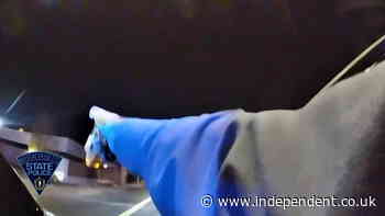 Video: Knife-wielding suspect hurls axe at police car