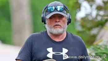 Guess who? Rarely seen Aussie actor goes incognito as he uses leaf blower outside Sydney home