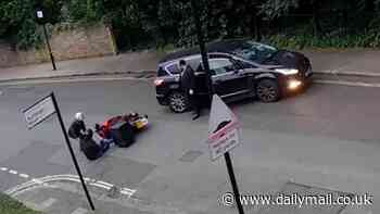 Moment 'cash for crash' motorcyclist lays down moped and drops to the floor as he fakes accident with car to claim insurance cash