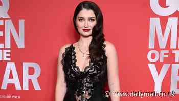 Eve Hewson shows off her cleavage in a daring lace satin dress as she joins her fellow honourees on the red carpet at 2024 GQ Men Of The Year awards