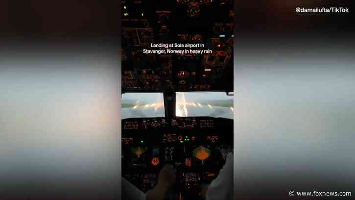 Flight attendant's viral video shows pilots landing in heavy rainstorm