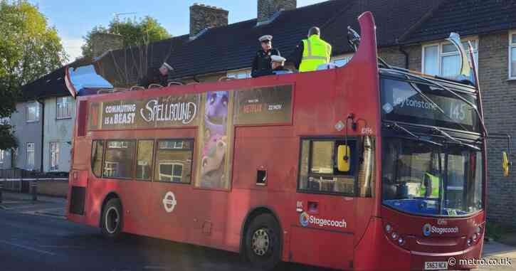 Double decker bus roof ripped off after crashing into tree in east London