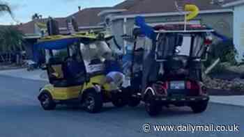 Shocking moment two golf carts collide head-on during parade