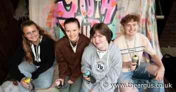 Young people help to decorate new youth hub site with graffiti murals