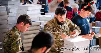 Soldiers pack Christmas boxes for 2,500 military children with parents overseas