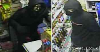 CCTV image released as robbers armed with knife attack a shop worker