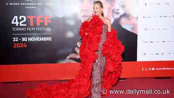 Sharon Stone, 66, looks incredible in a dramatic ruffled red cape as she joins glamorous Sarah Jessica Parker, 59, at the 42nd Torino Film Festival