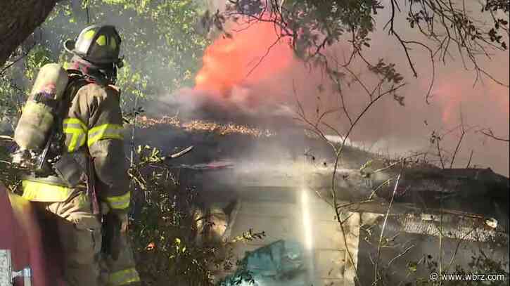 Firefighters work to contain abandoned house fire at corner of Aster Street, Nicholson Drive