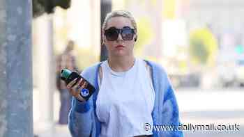 Amanda Bynes flashes her taut midriff in a white crop top while out vaping in LA