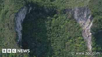 China's huge sinkholes reveal hidden treasures as viral videos draw tourists