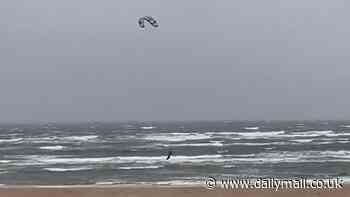 Jaw-dropping moment kitesurfer battling Storm Bert gales takes off into the air