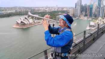 Barmy Army trumpeter scales iconic Sydney Harbour Bridge and belts out tunes in bid to wind up the Aussies a year before the Ashes