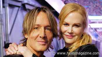 Nicole Kidman and Keith Urban share a kiss as she joins him on stage for surprise appearance